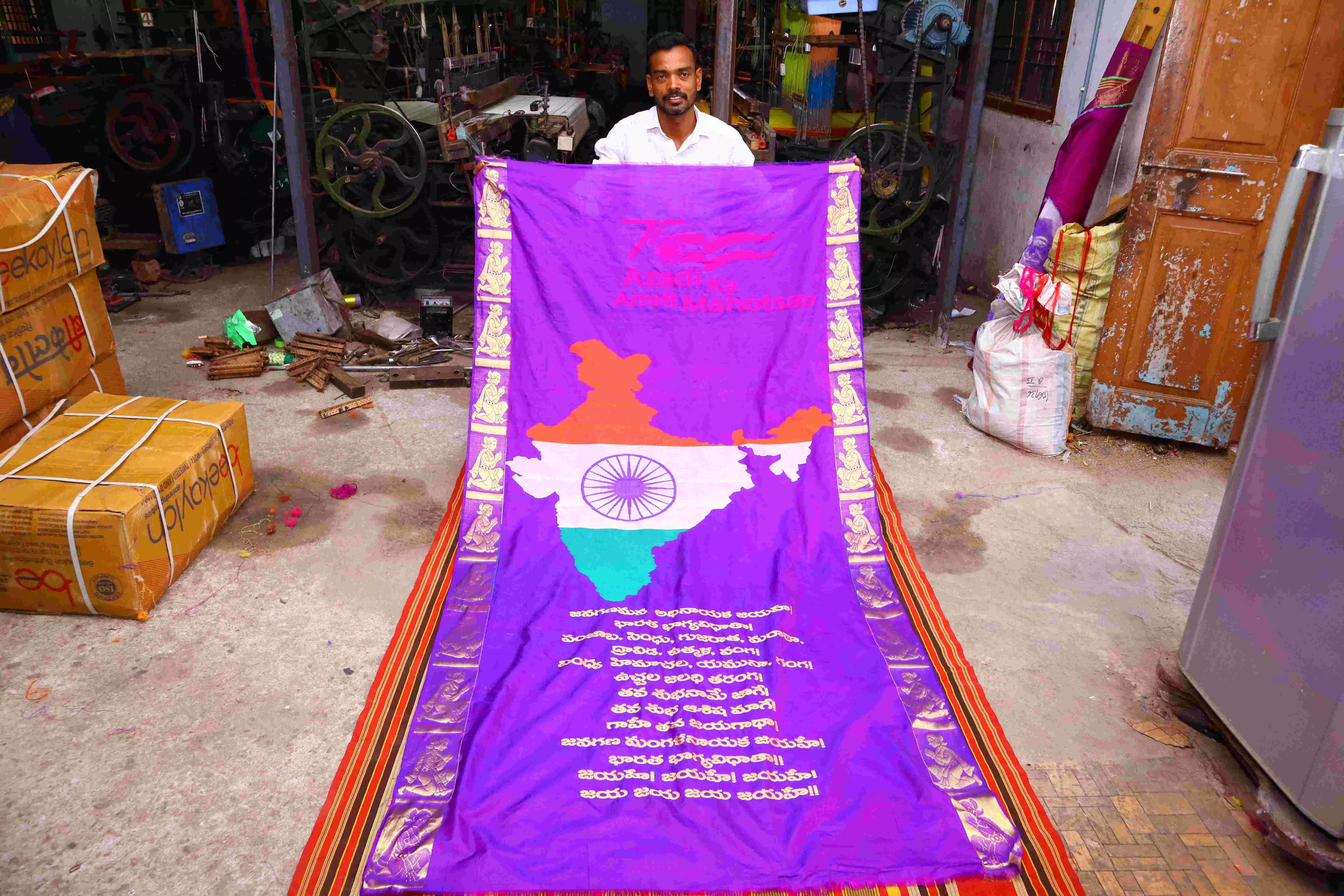 Sircilla craftsman Veldi Hari Prasad weaves Jana Gana Mana on silk fabric