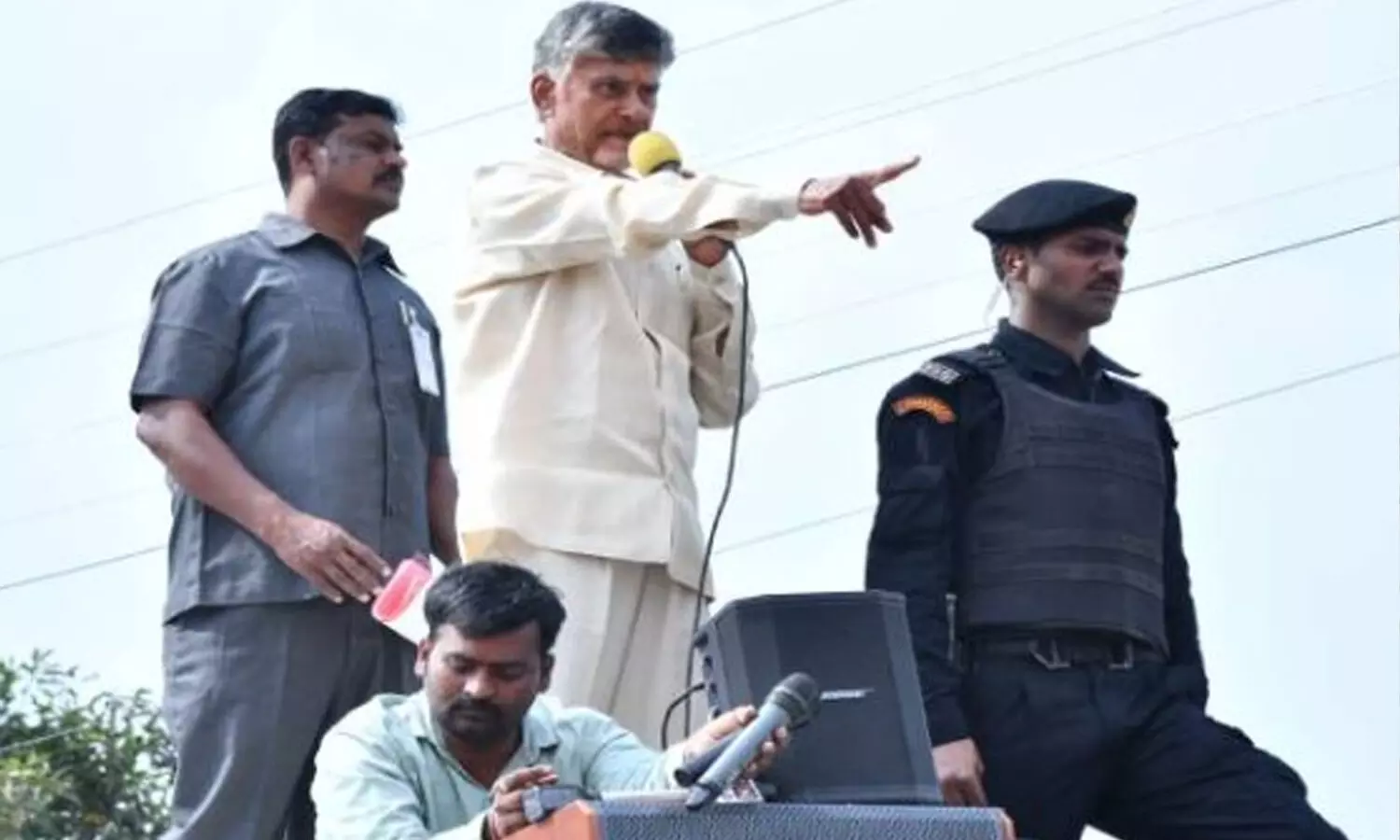 Chandrababu squats on road, perches on top of bus, slams YS Jagan in Kuppam