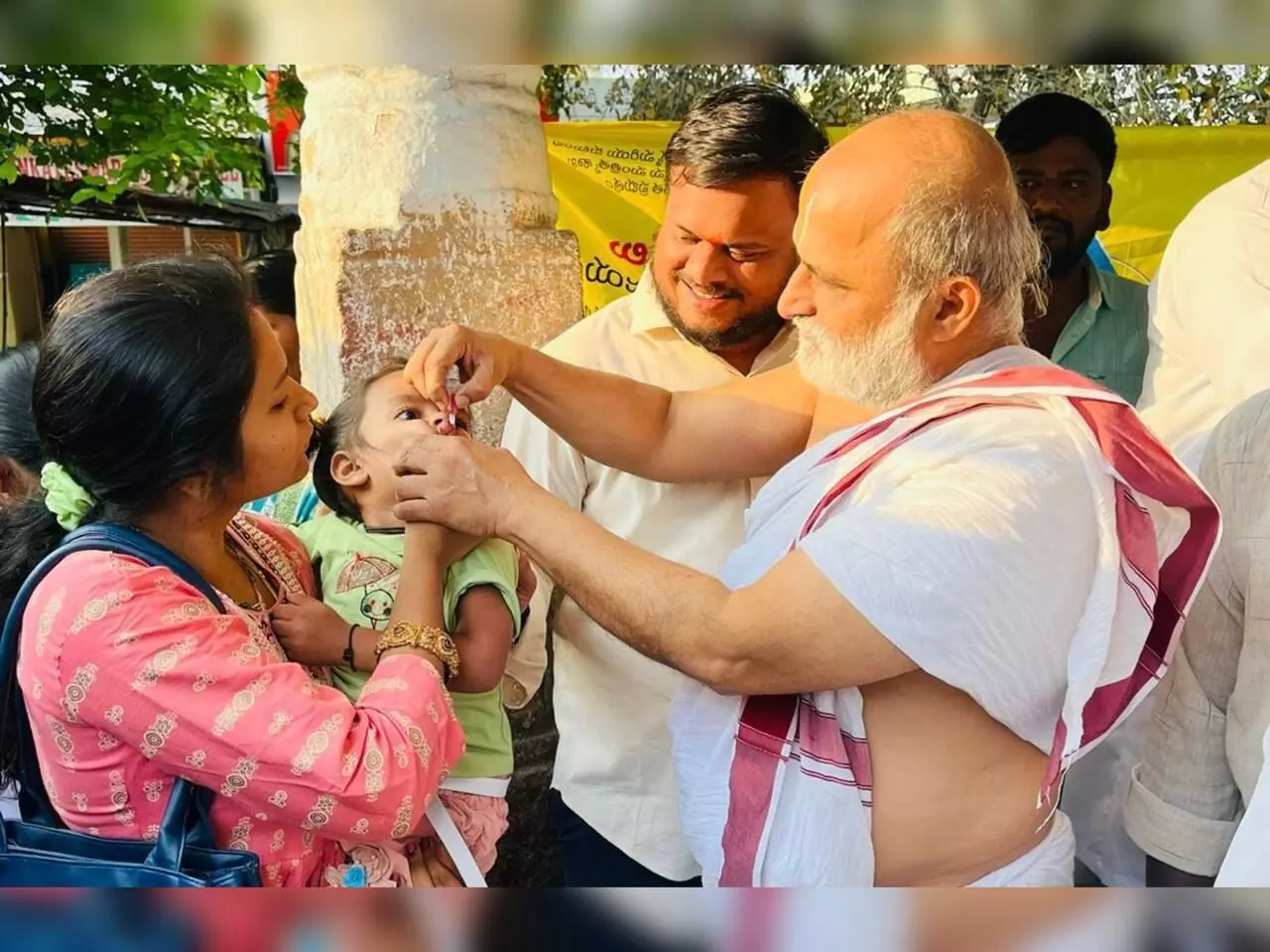 Chilkur priest Rangarajan administers polio drops as part of Pulse Polio programme